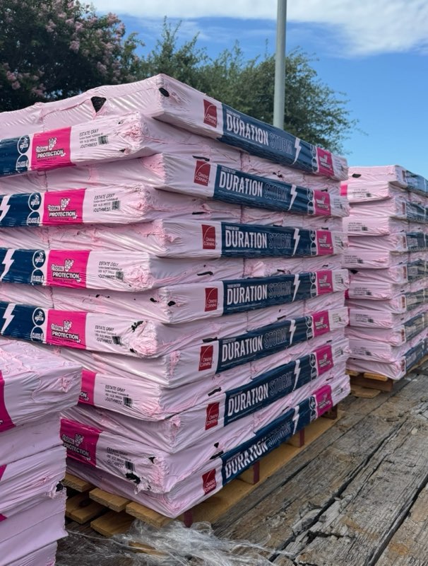 Pallets of Owens Corning Duration Storm shingles staged for a Hill Heights roof replacement